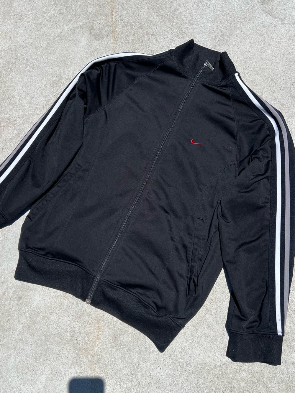 Nike Black Track Jacket with White Sleeve Stripes and Red Swoosh